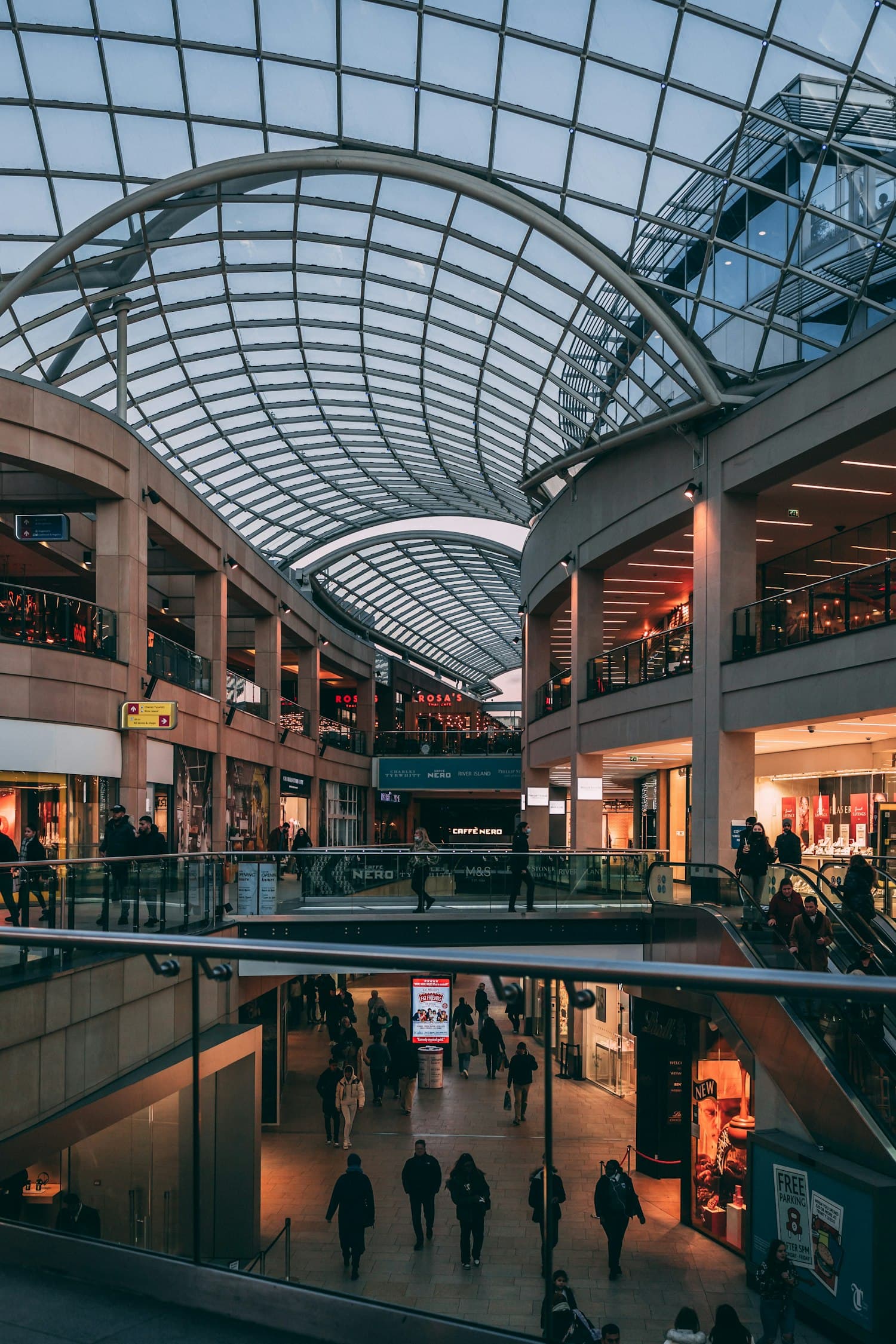People moving through a large retail interior
