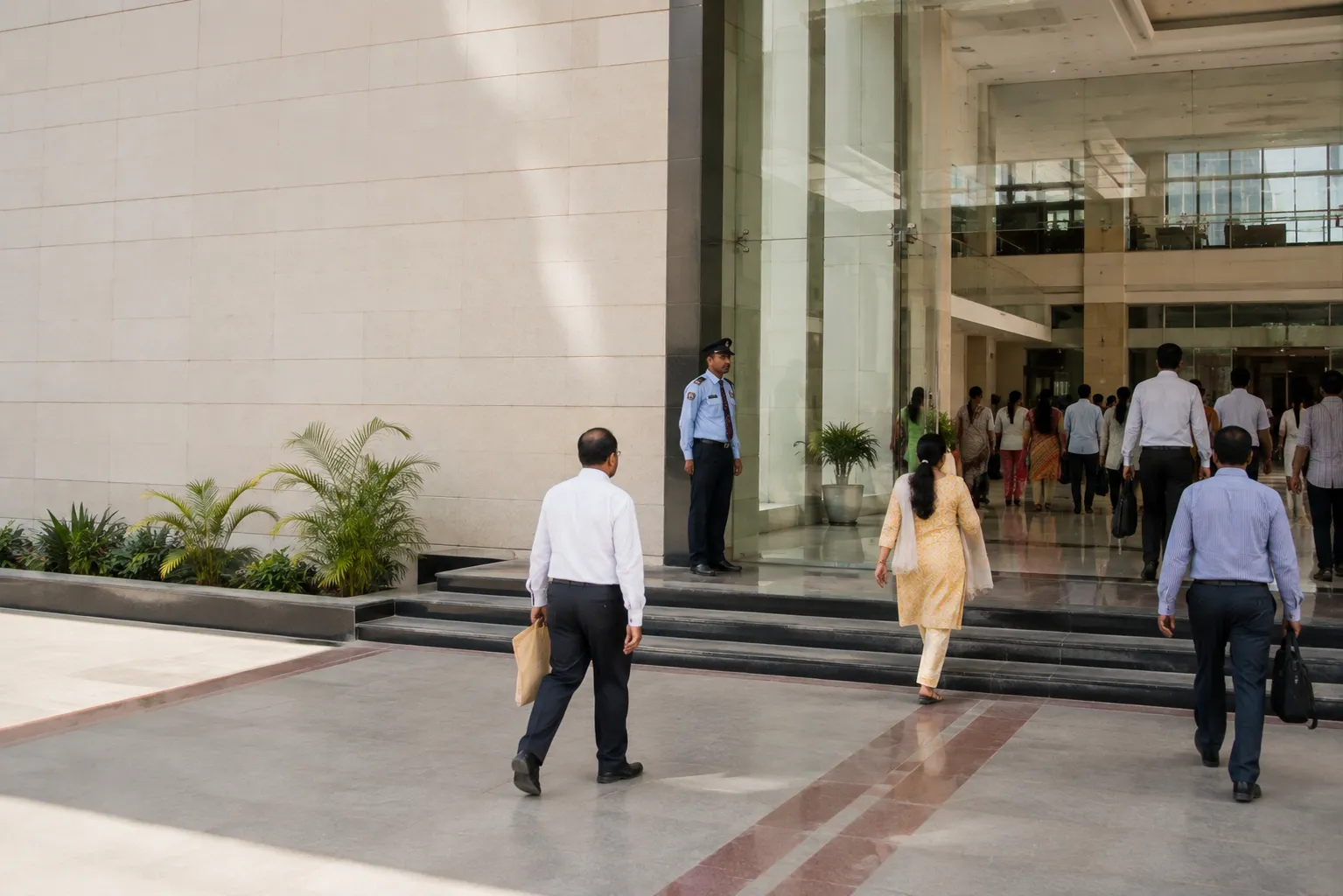 iDONE Corporate and Government Employees walking through an office building entrance representing iDONE in corporate and government sectors