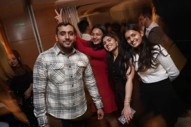 Colleagues posing together at an office party