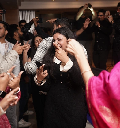 Team members dancing and celebrating together