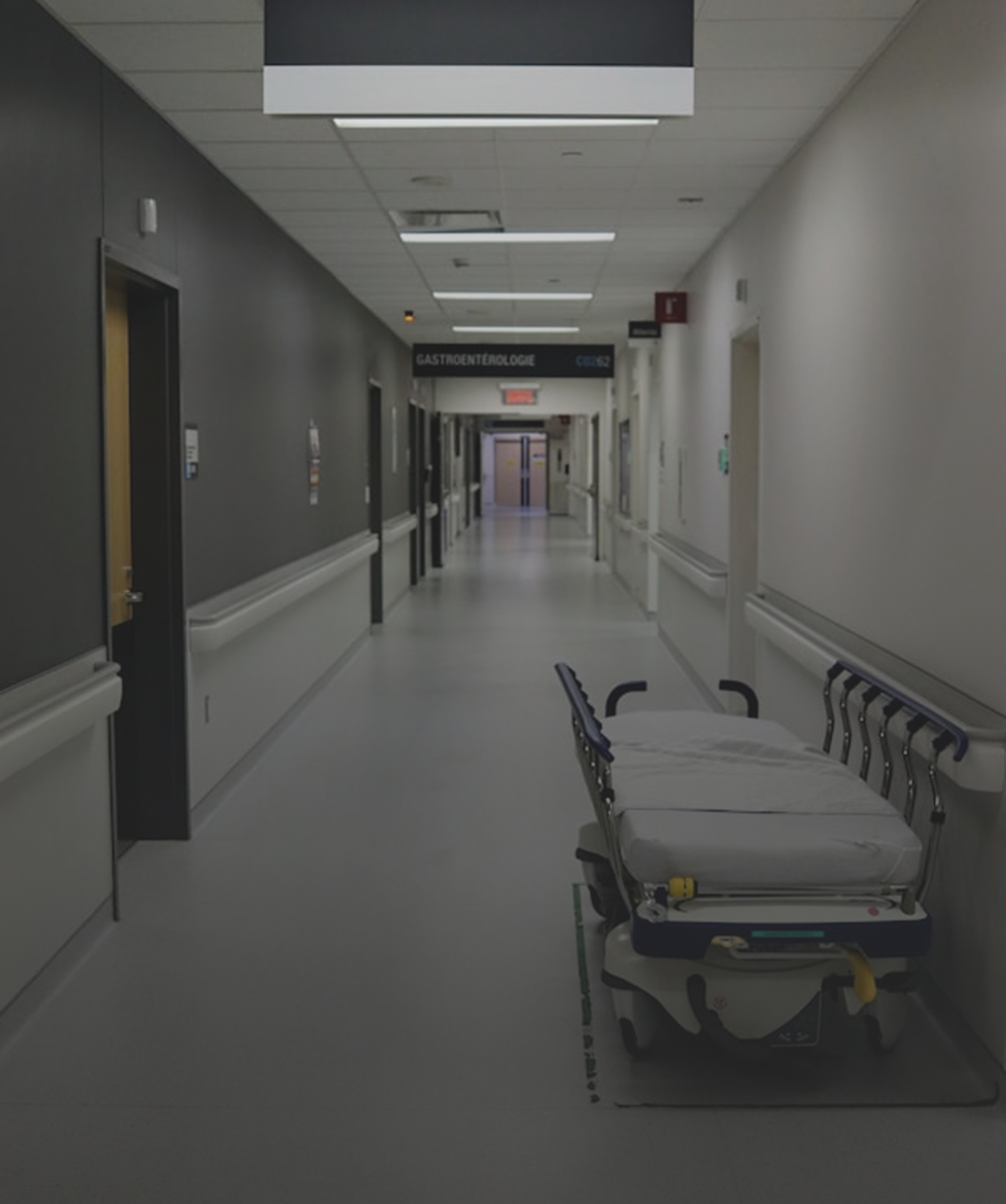 Healthcare Facility Security and Monitoring Hospital corridor with a stretcher trolley, representing healthcare facility security