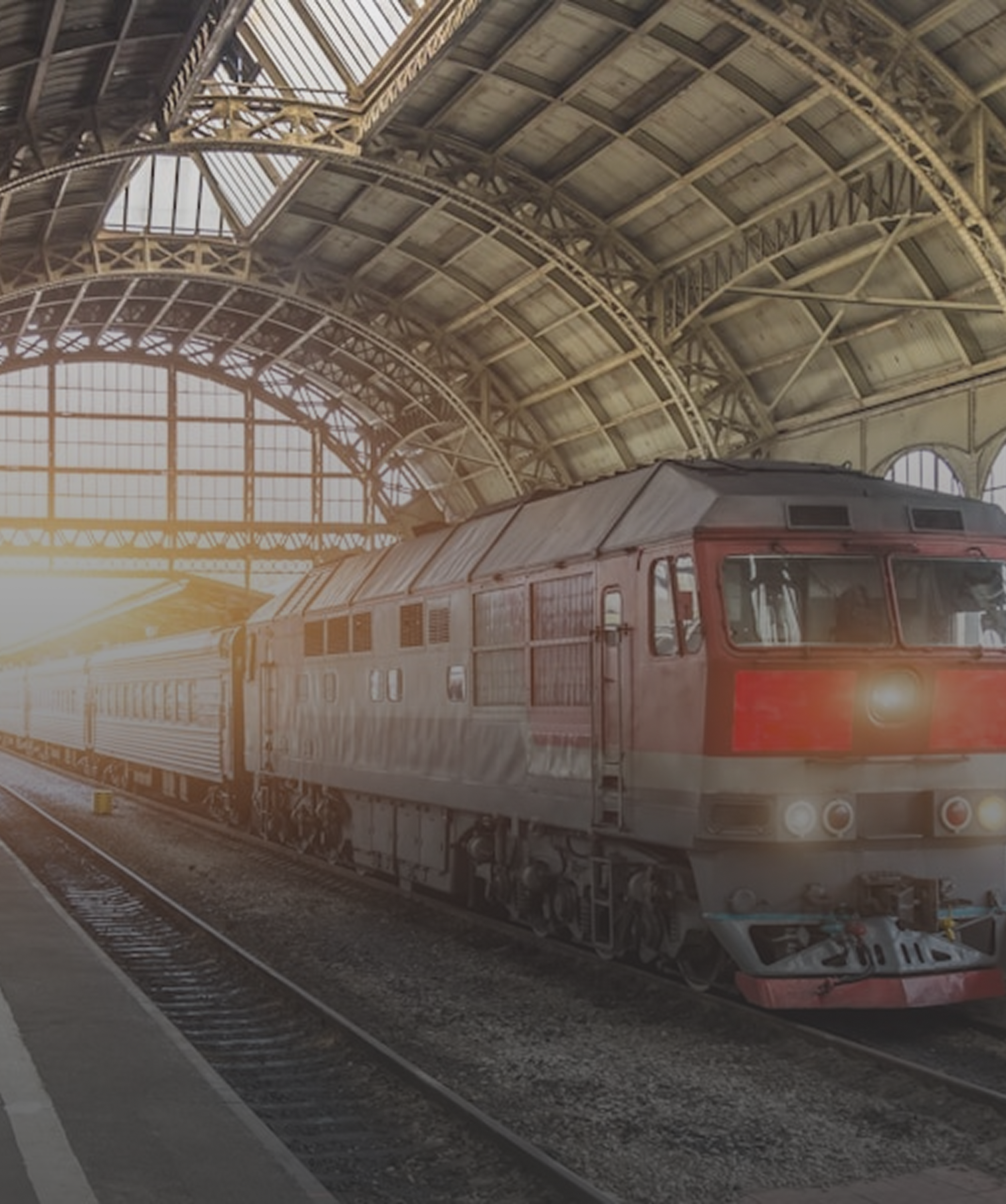 Railway and Transport Surveillance Train arriving at a covered railway station for transport and railway surveillance solutions