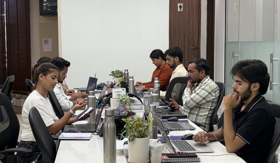 Colleagues at their workstations